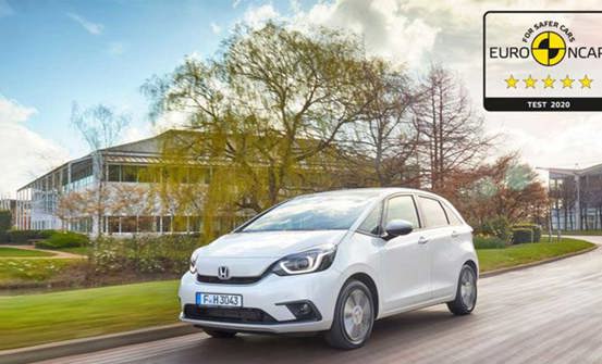 Honda Jazz driving with the Euro NCAP test tag where the car scores top marks.
